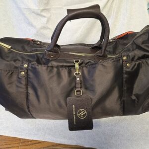 Stylish Black Duffel Bag with Gold Accents